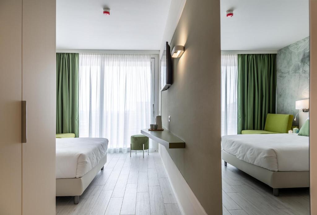 Кровать или кровати в номере Hotel Amburgo