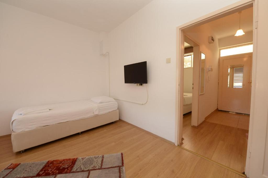 Postel nebo postele na pokoji v ubytování Otel Diyojen