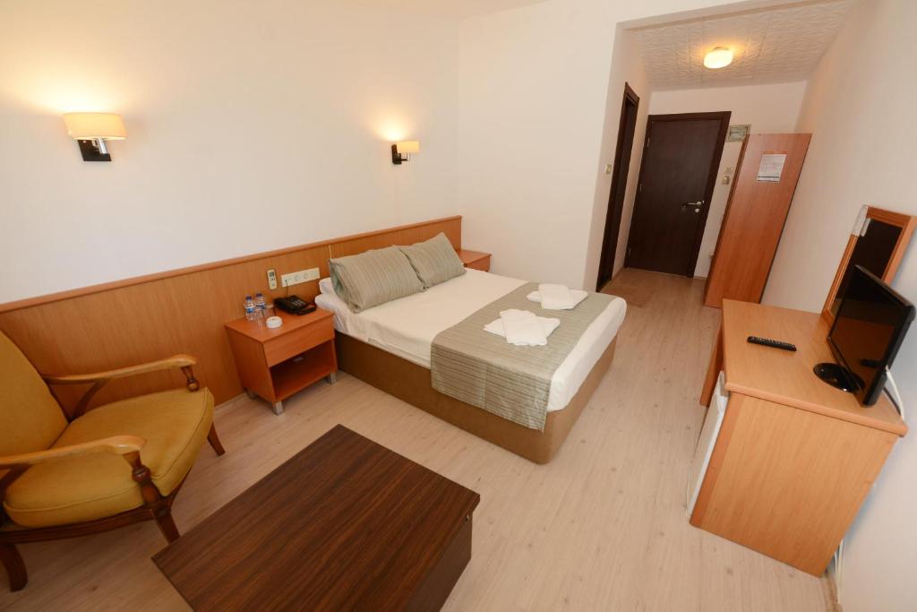 Postel nebo postele na pokoji v ubytování Otel Diyojen