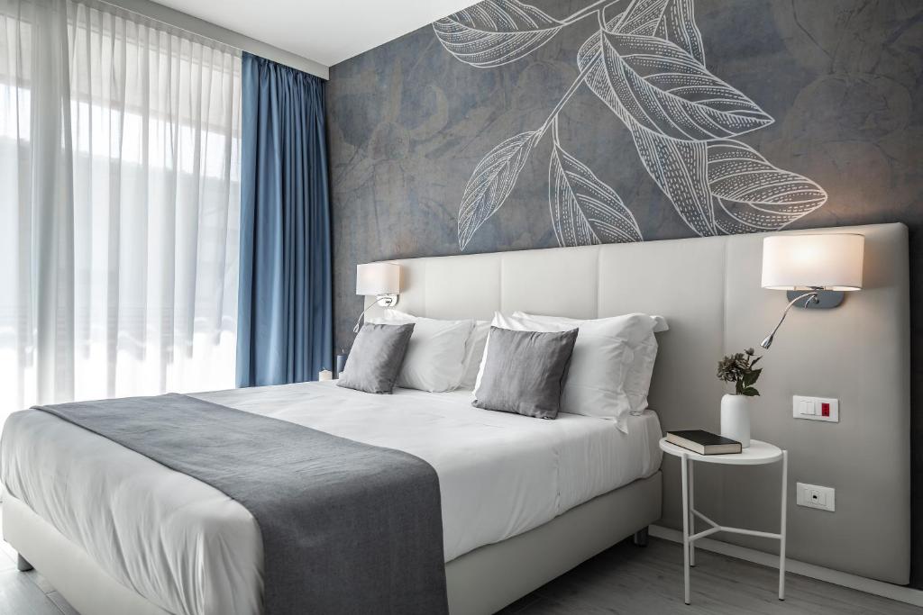Кровать или кровати в номере Hotel Amburgo