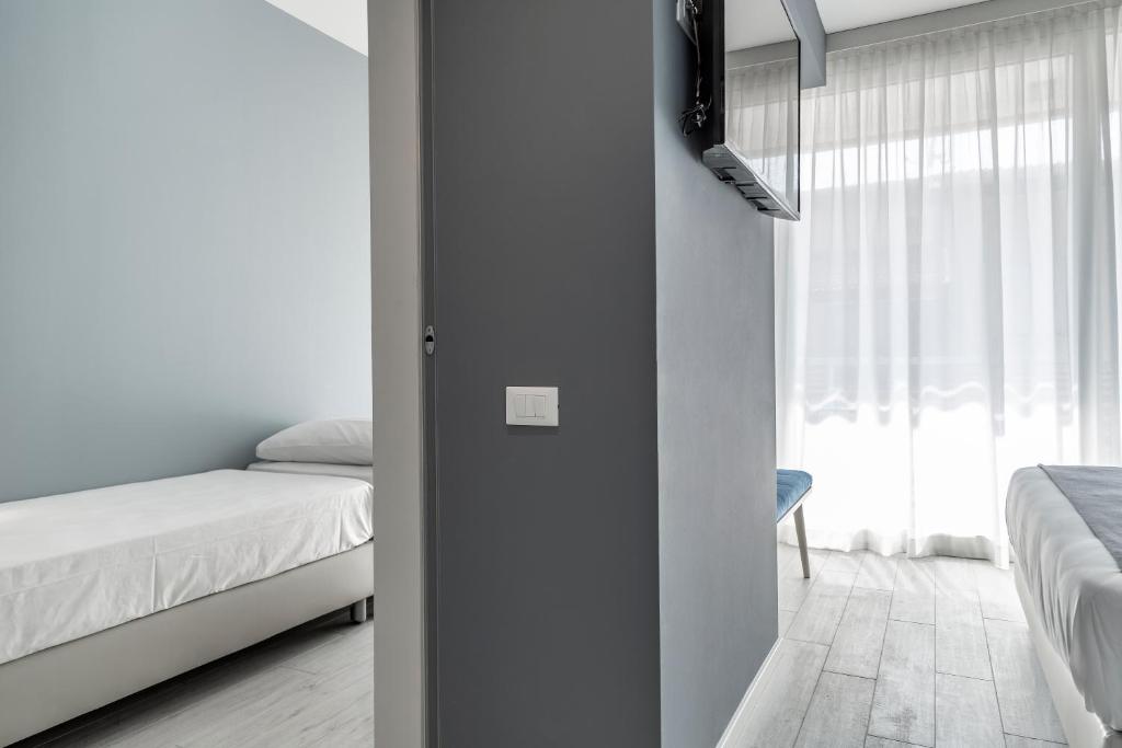 Кровать или кровати в номере Hotel Amburgo