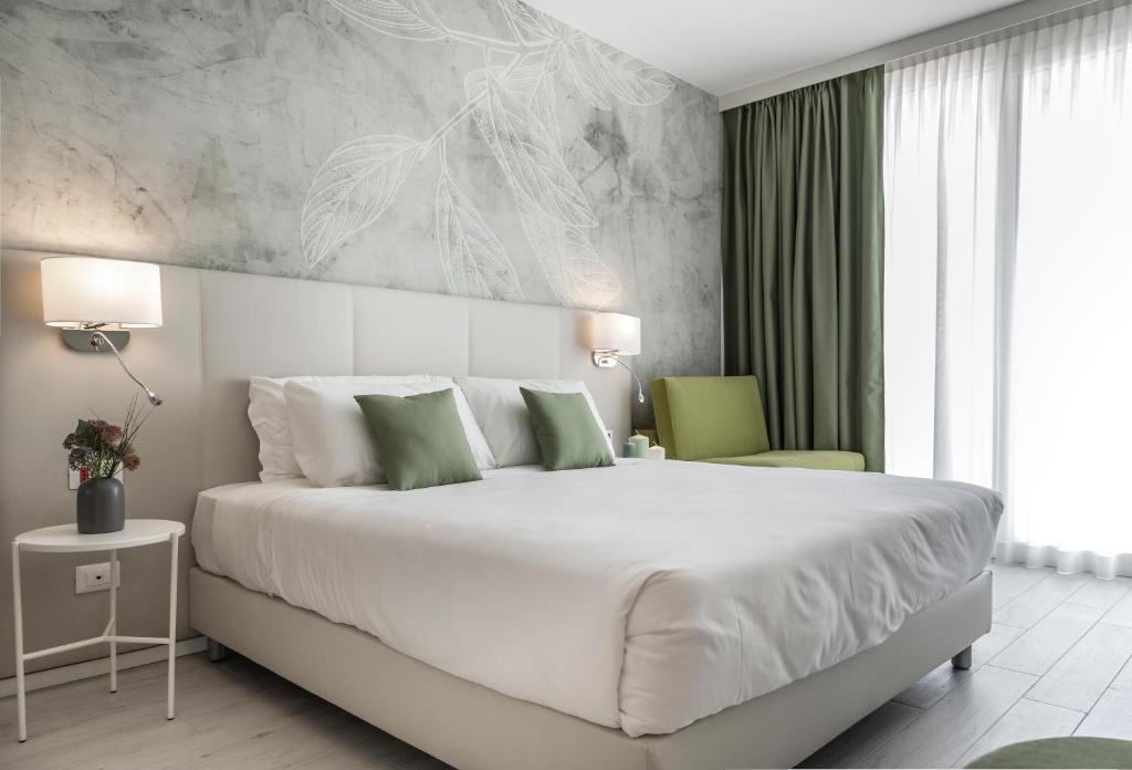 Кровать или кровати в номере Hotel Amburgo