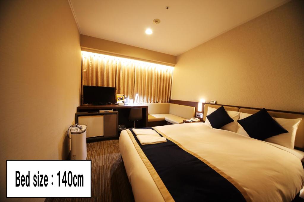 Postel nebo postele na pokoji v ubytování Hotel Sunroute Asakusa