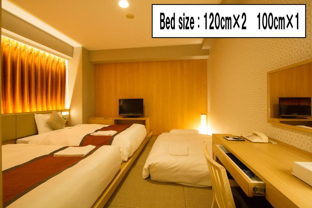 Postel nebo postele na pokoji v ubytování Hotel Sunroute Asakusa