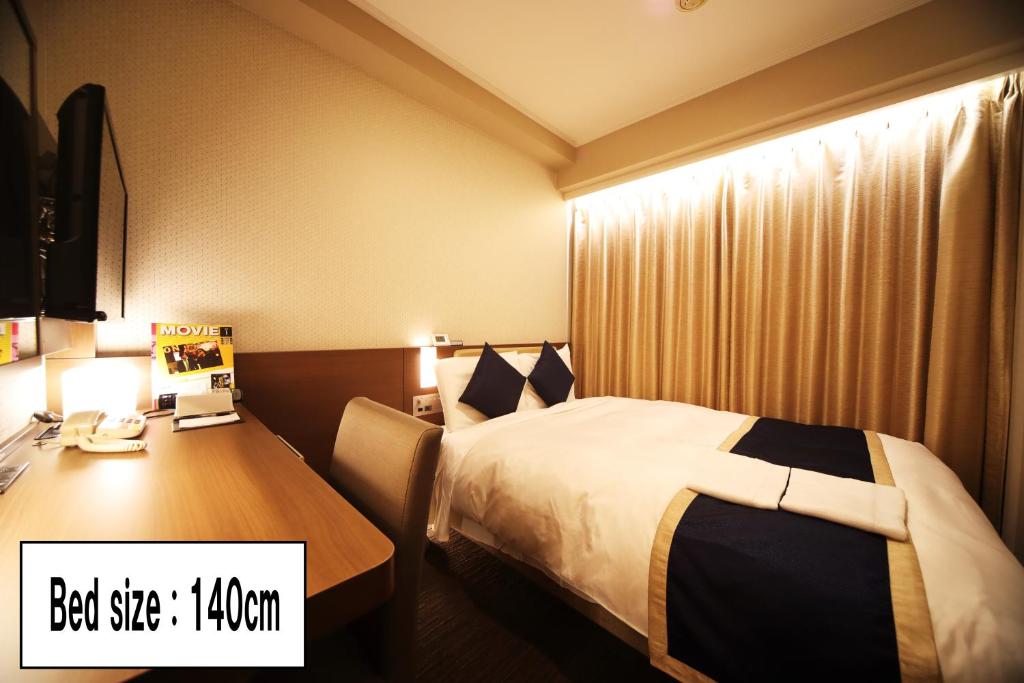 Postel nebo postele na pokoji v ubytování Hotel Sunroute Asakusa