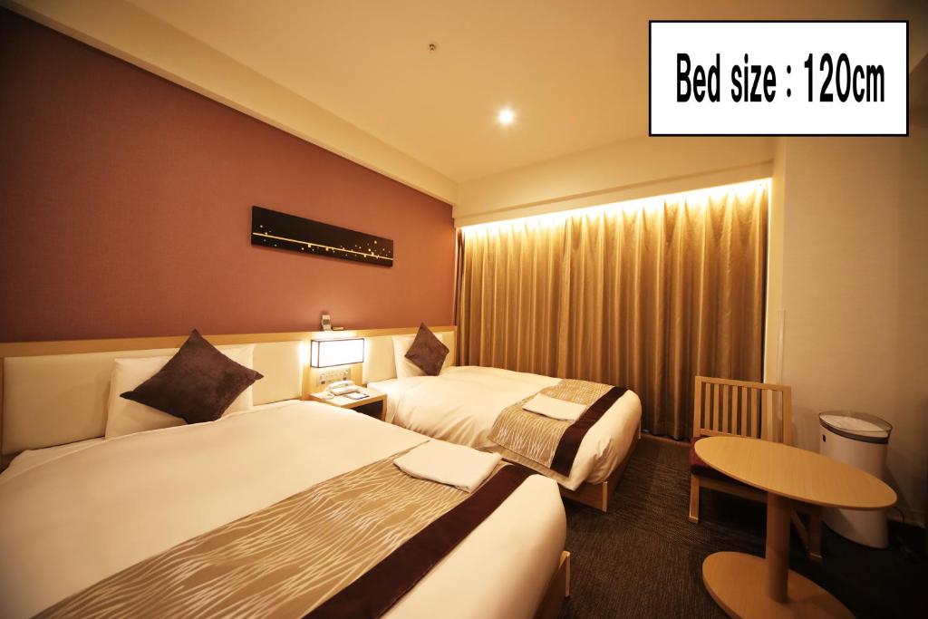 Postel nebo postele na pokoji v ubytování Hotel Sunroute Asakusa