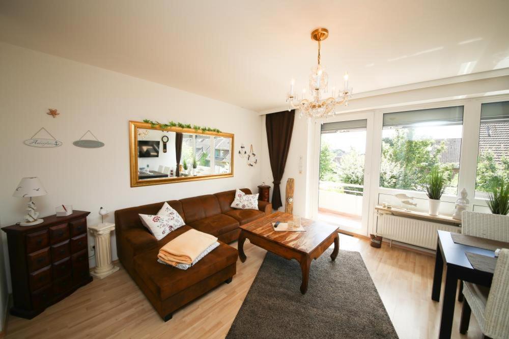 a living room with a couch and a table at Ferienwohnung Emmas Nest 1 in Haffkrug