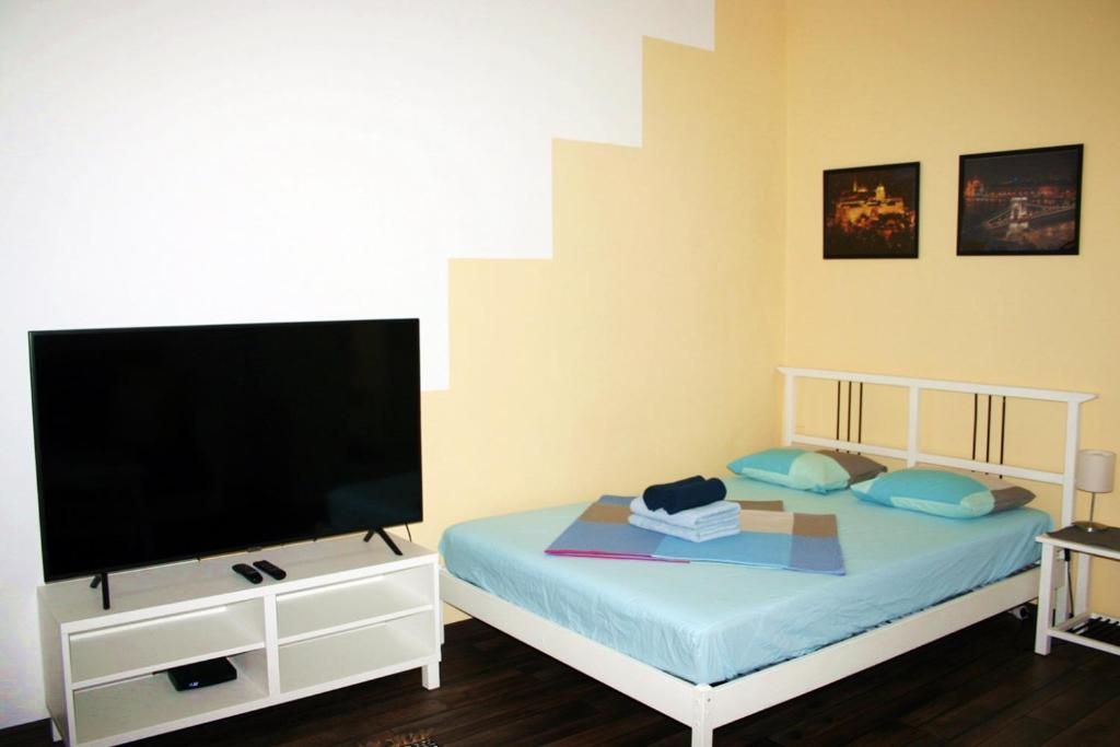 Postel nebo postele na pokoji v ubytování Honey Home