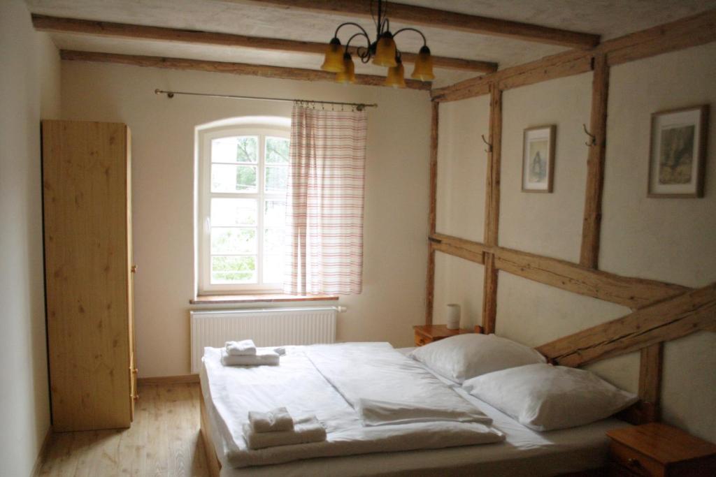 Postel nebo postele na pokoji v ubytování Karczma Bełty