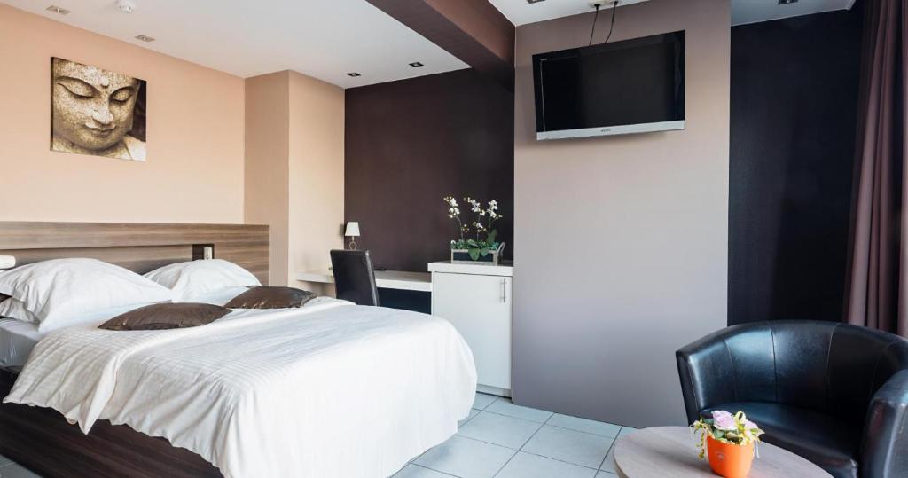 Postel nebo postele na pokoji v ubytování Hotel De Zeebries