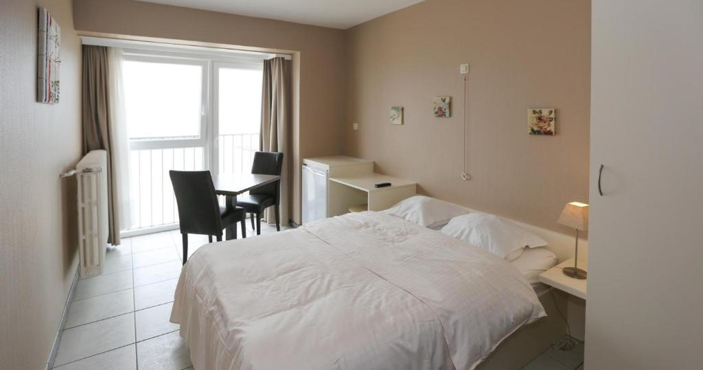 Postel nebo postele na pokoji v ubytování Hotel De Zeebries