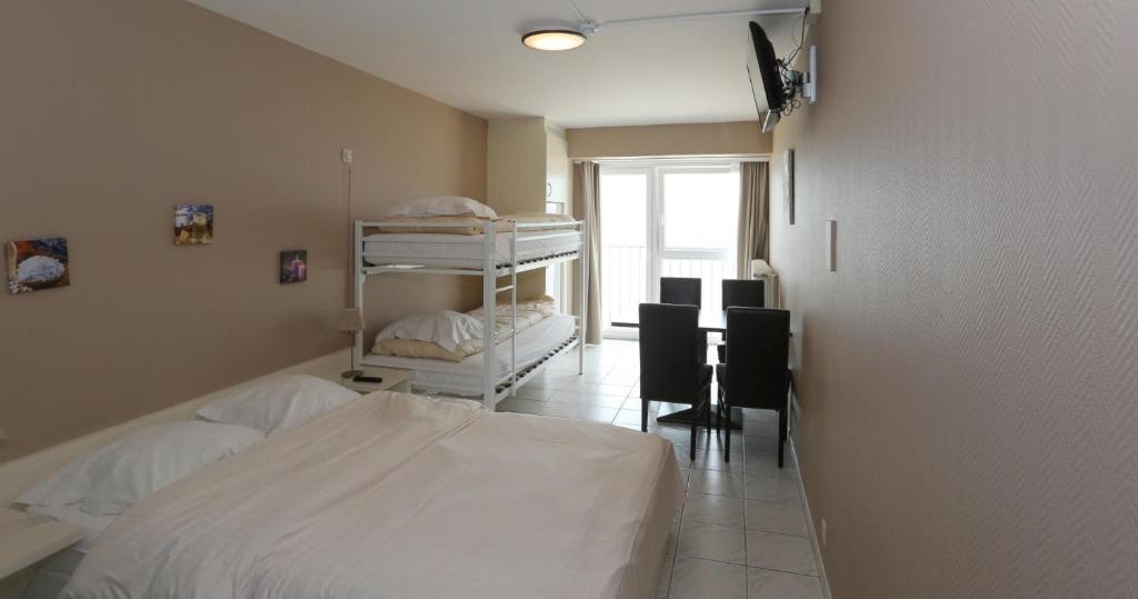 Postel nebo postele na pokoji v ubytování Hotel De Zeebries