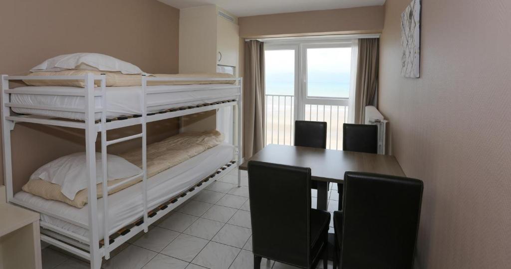 Postel nebo postele na pokoji v ubytování Hotel De Zeebries
