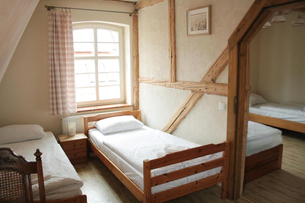 Postel nebo postele na pokoji v ubytování Karczma Bełty