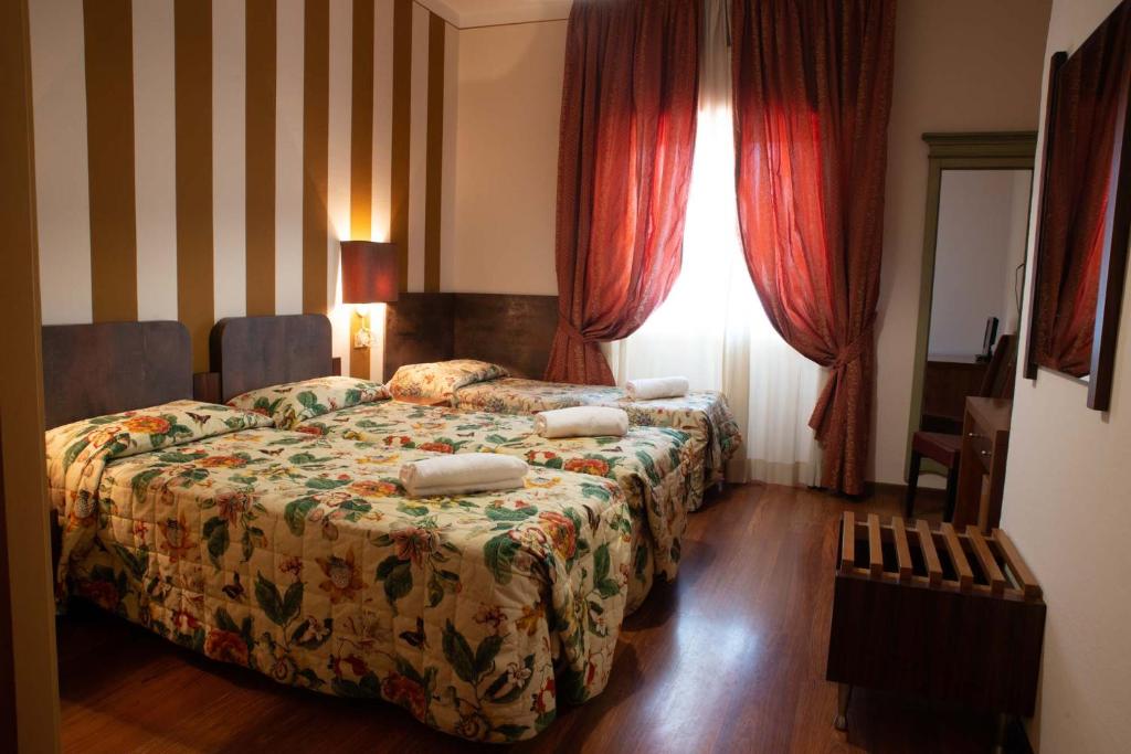 Postel nebo postele na pokoji v ubytování Vivo Hotel