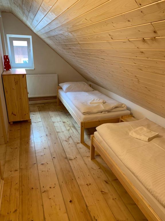 Postel nebo postele na pokoji v ubytování Apartmány Michaela