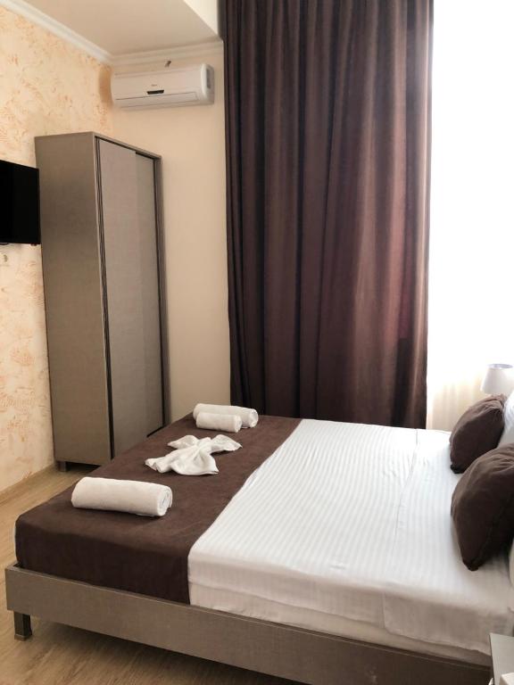 Postel nebo postele na pokoji v ubytování Guesthouse Family