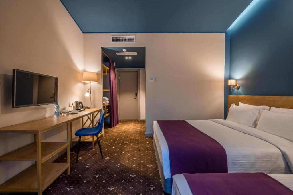 Postel nebo postele na pokoji v ubytování Gladius Inn Boutique Hotel by DNT Group