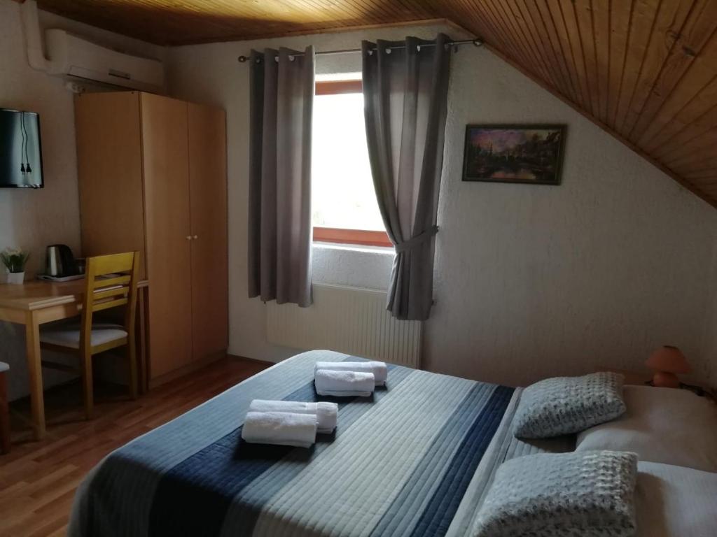 Postel nebo postele na pokoji v ubytování House Viktoria