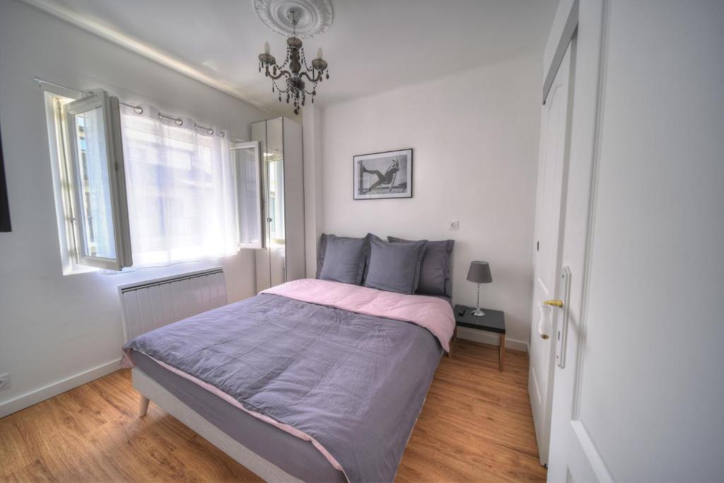 Кровать или кровати в номере La petite Venise