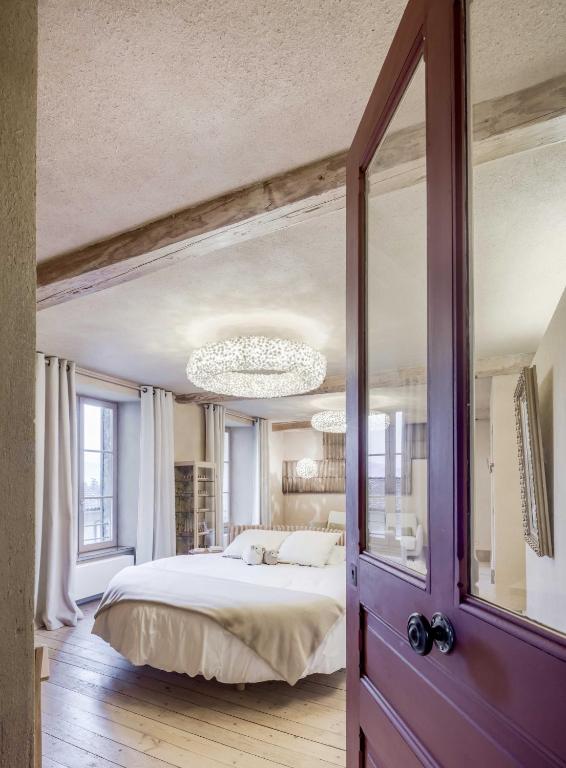 Cama o camas de una habitación en Ancienne fabrique de soie À la Galicière