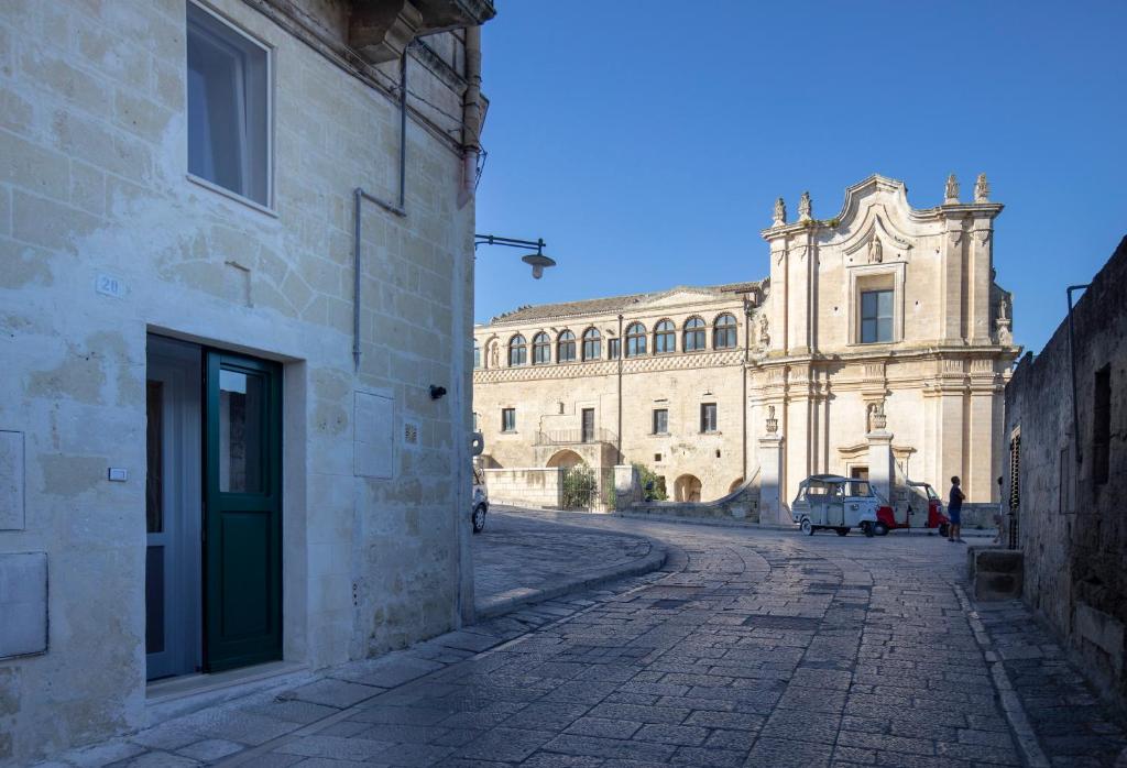 an empty street in front of a large building at La Casa di Montegrosso in Matera