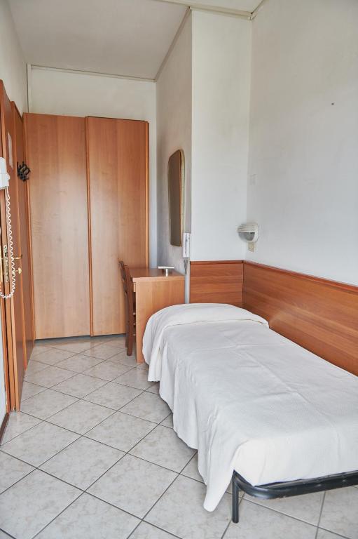 Postel nebo postele na pokoji v ubytování Hotel Caesar Bed and Breakfast