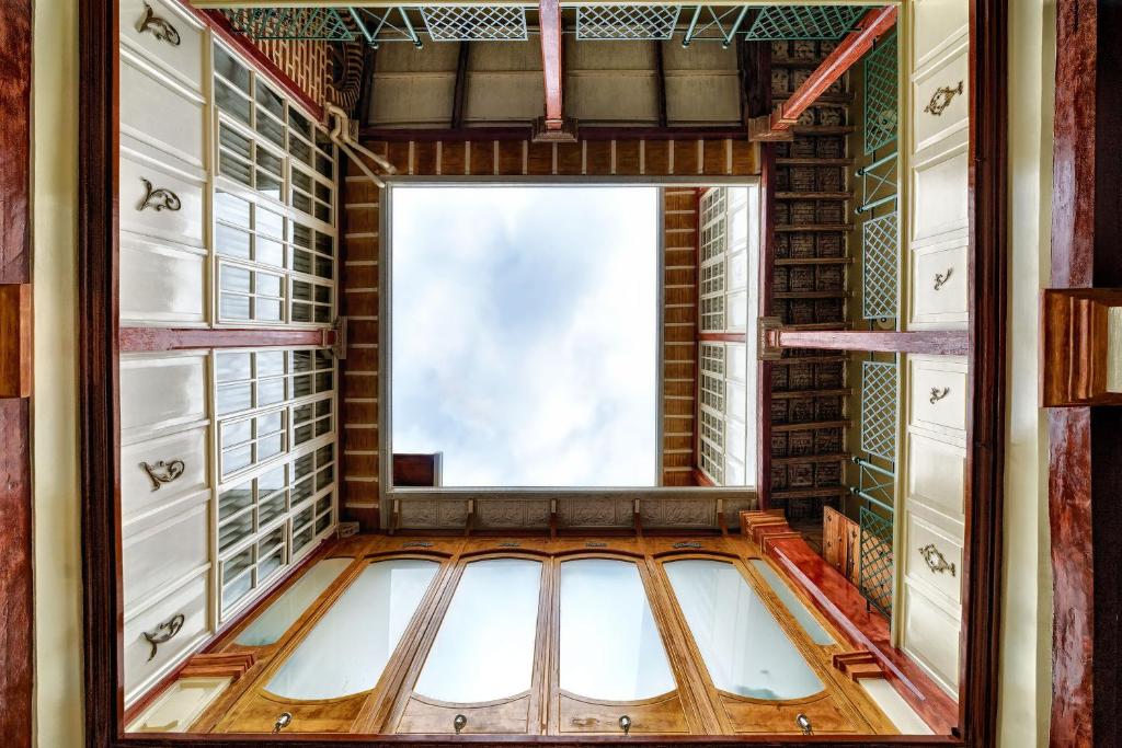 a large window in a room with a wooden floor at Old Town Quito Suites, Heritage Boutique Hotel, Where Every Detail Tells a Story in Quito