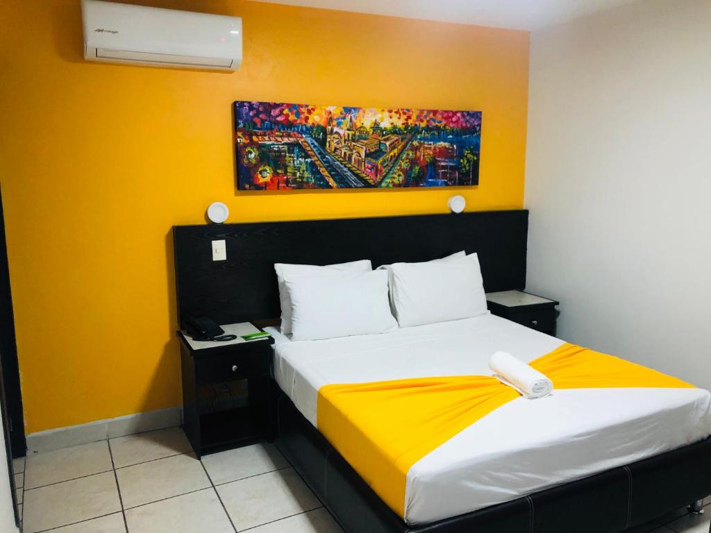 Postel nebo postele na pokoji v ubytování Hotel Belisario INN