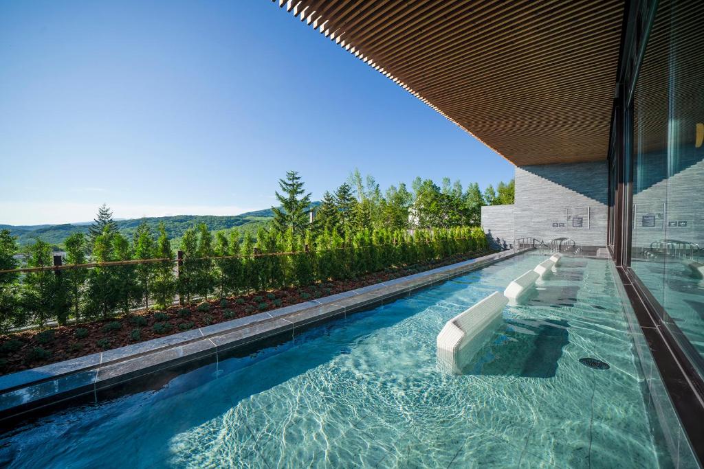 a swimming pool in the side of a building at Rusutsu Resort Hotel & Convention in Rusutsu