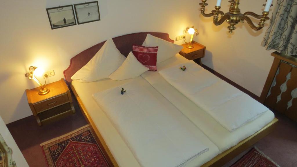 Postel nebo postele na pokoji v ubytování s'Landhaus