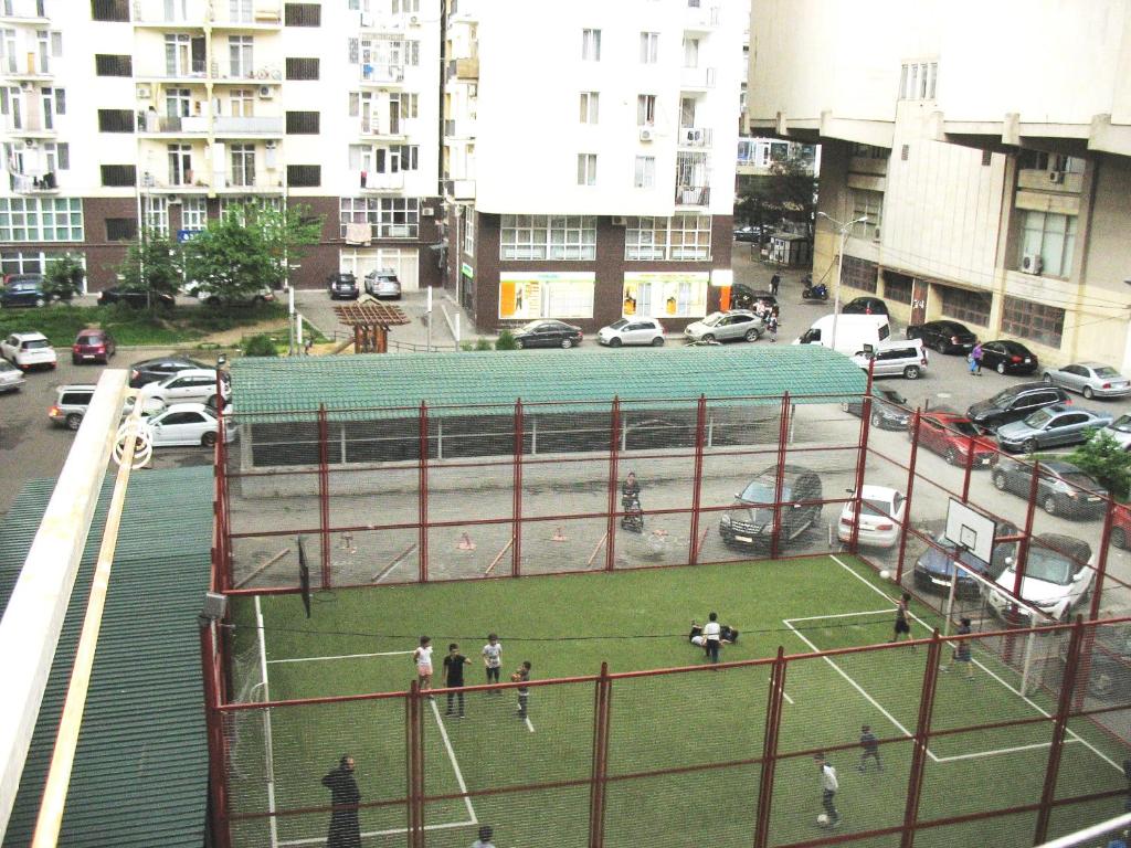 a tennis court in the middle of a city at Tbilisi Comfort in Tbilisi City