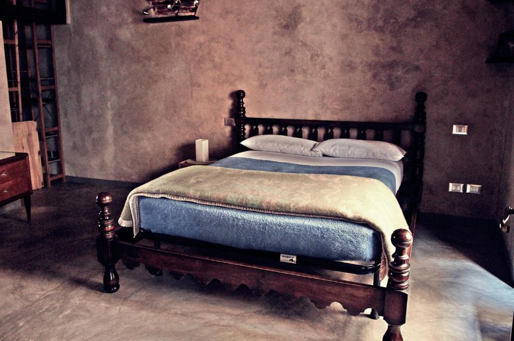 A bed or beds in a room at Lovingenoa - Antico Convento