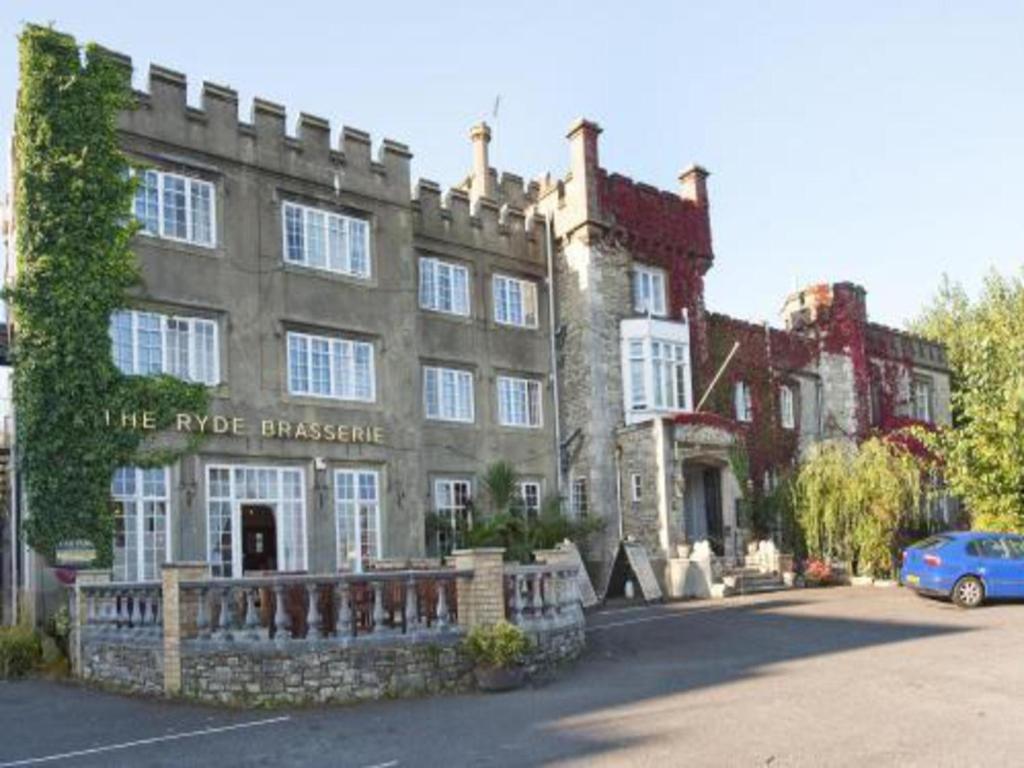 a large building with a car parked in front of it at Ryde Castle by Greene King Inns in Ryde