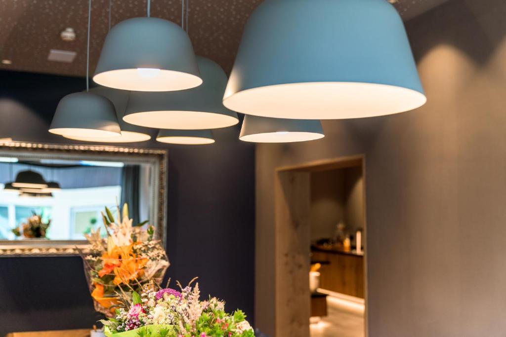 Televiisor ja/või meelelahutuskeskus majutusasutuses Stadtvilla Schladming Boutiquehotel