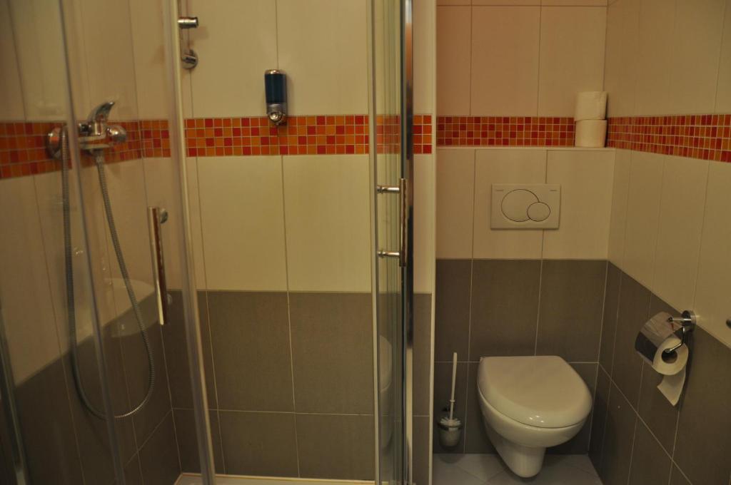 a bathroom with a shower and a toilet at City Central De Luxe in Prague