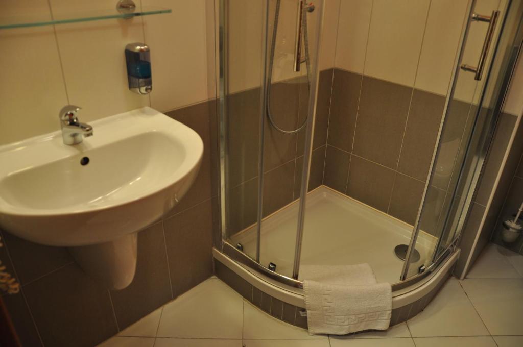 a bathroom with a sink and a shower at City Central De Luxe in Prague