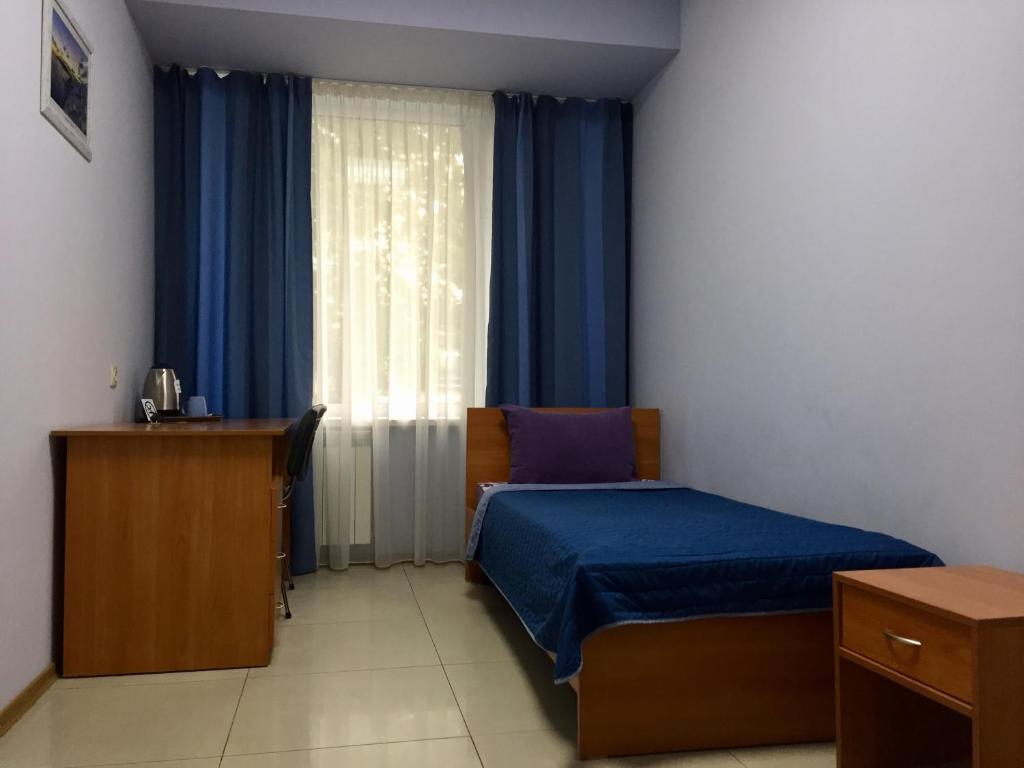 Postel nebo postele na pokoji v ubytování Westend Hotel Kyiv