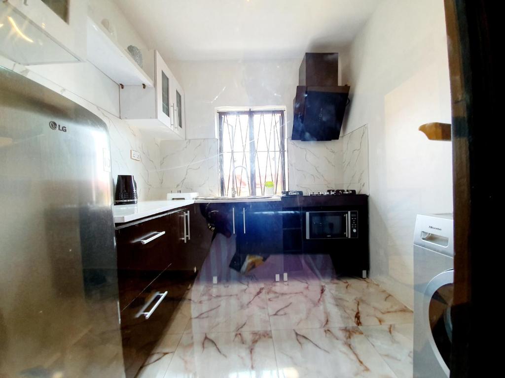 Kuchyň nebo kuchyňský kout v ubytování CG Apartments Metro