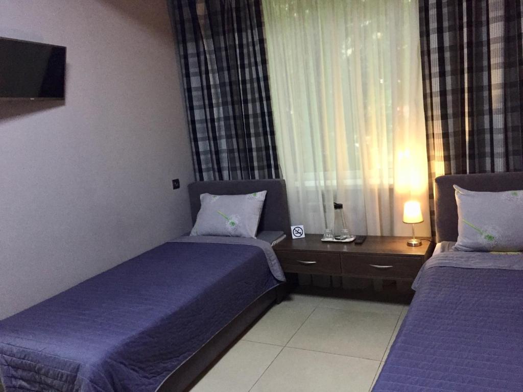 Postel nebo postele na pokoji v ubytování Westend Hotel Kyiv