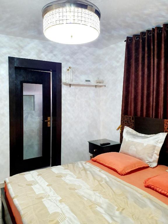 Postel nebo postele na pokoji v ubytování CG Apartments Metro
