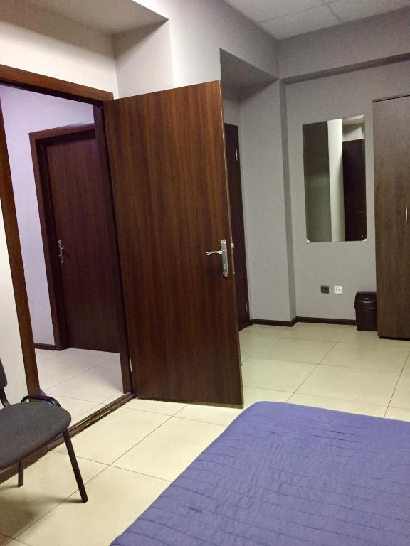 Postel nebo postele na pokoji v ubytování Westend Hotel Kyiv