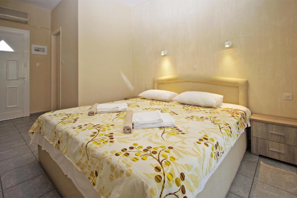 Postel nebo postele na pokoji v ubytování FunBeach Rooms