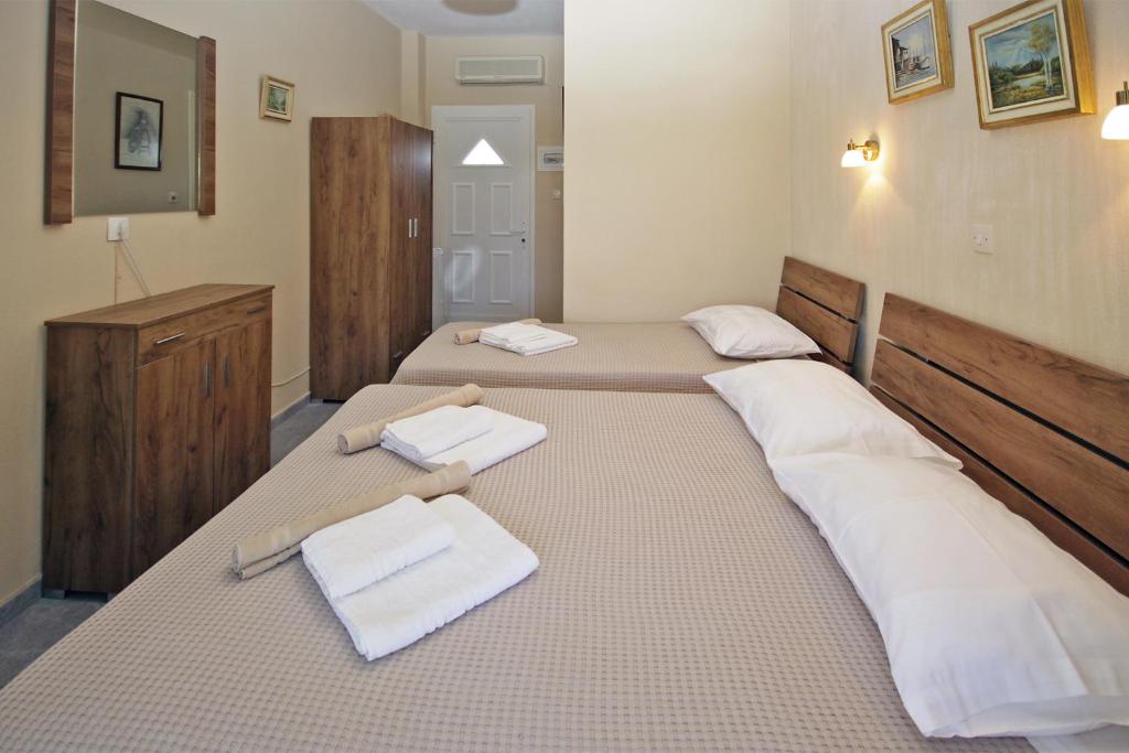 Postel nebo postele na pokoji v ubytování FunBeach Rooms