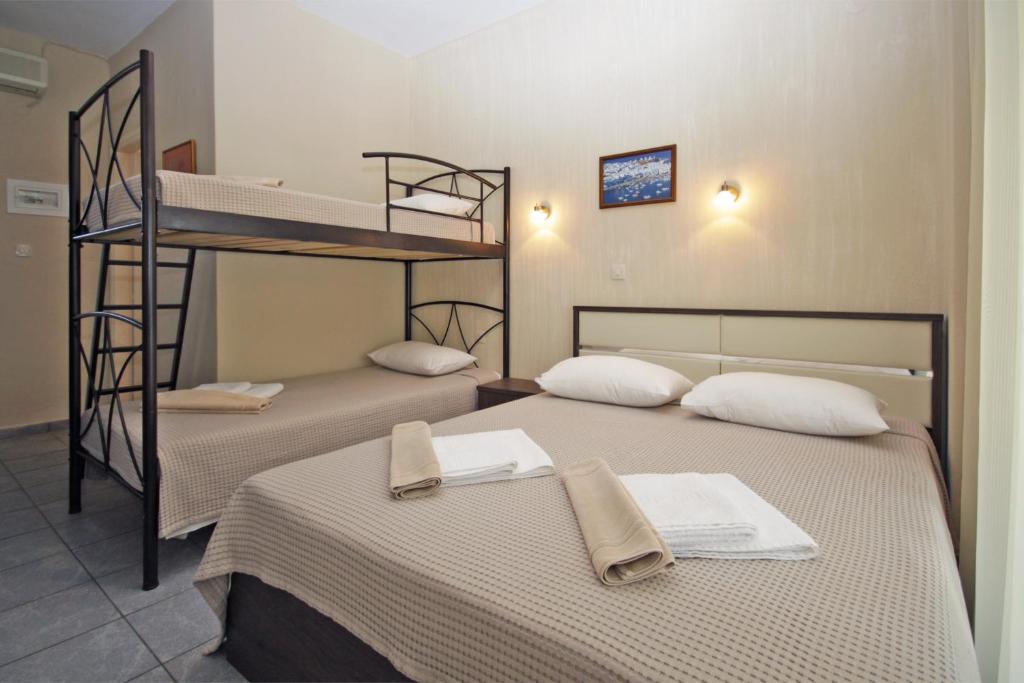 Postel nebo postele na pokoji v ubytování FunBeach Rooms