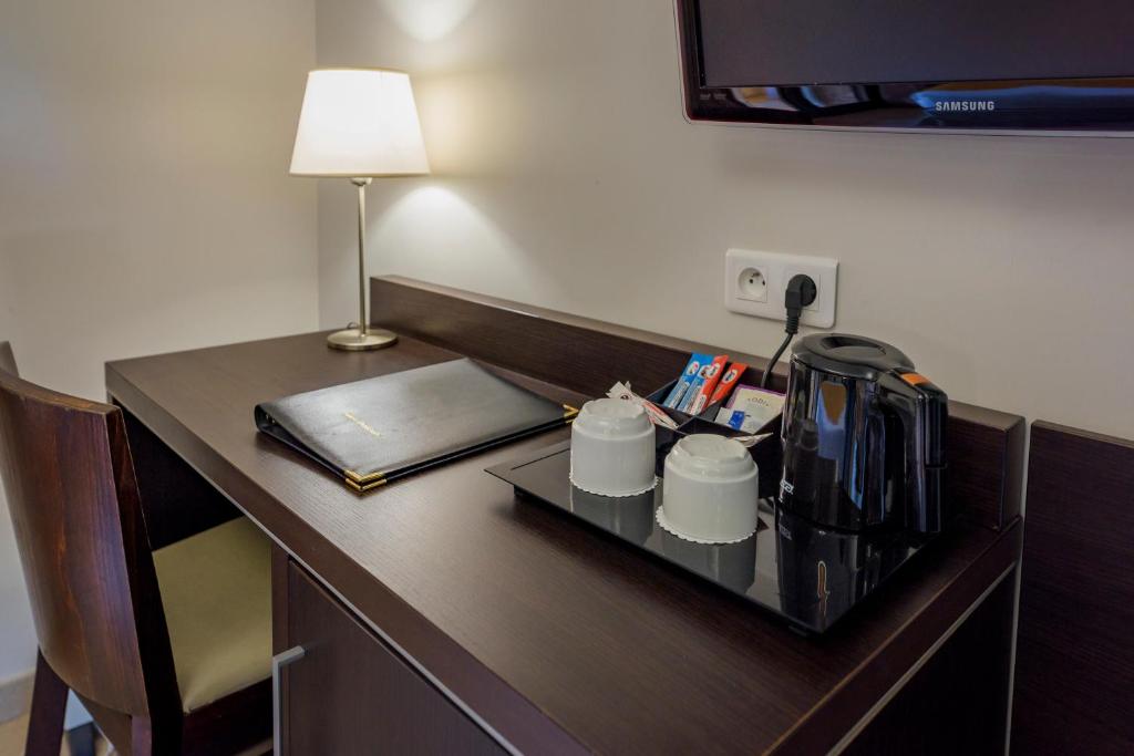 Postel nebo postele na pokoji v ubytování Hotel U Ricordu & Spa