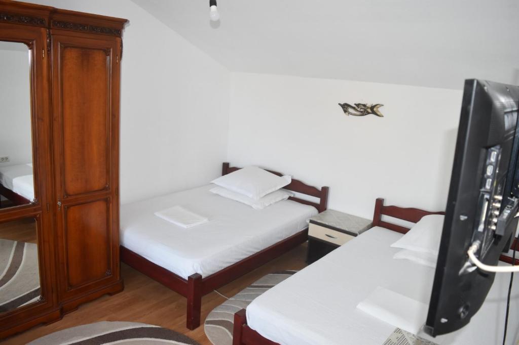 Giường trong phòng chung tại Vila Valentina