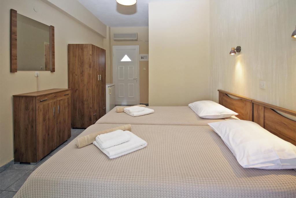 Postel nebo postele na pokoji v ubytování FunBeach Rooms