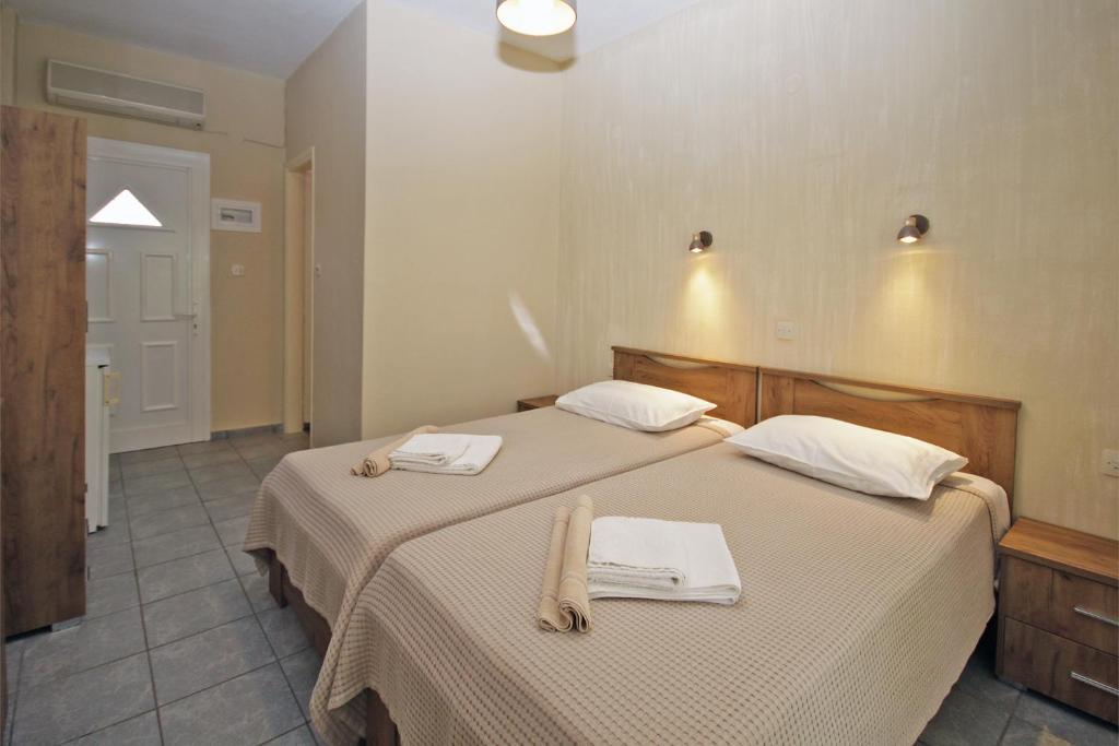 Postel nebo postele na pokoji v ubytování FunBeach Rooms
