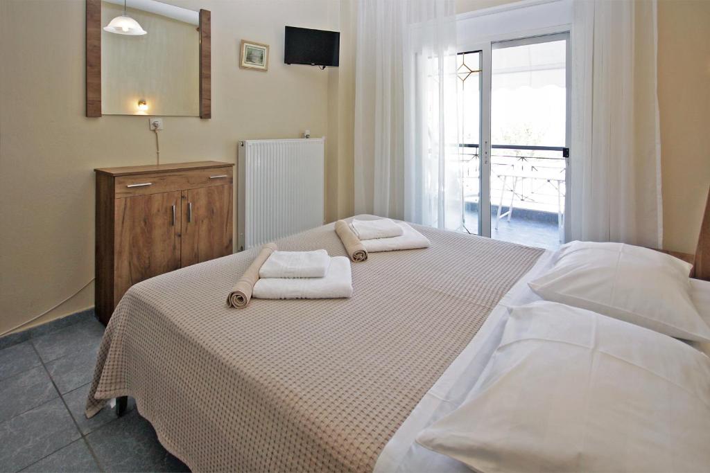 Postel nebo postele na pokoji v ubytování FunBeach Rooms
